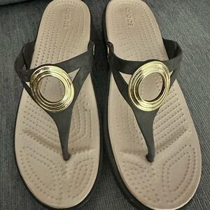 CROCS Gold and Black Sandals with Metallic Accent